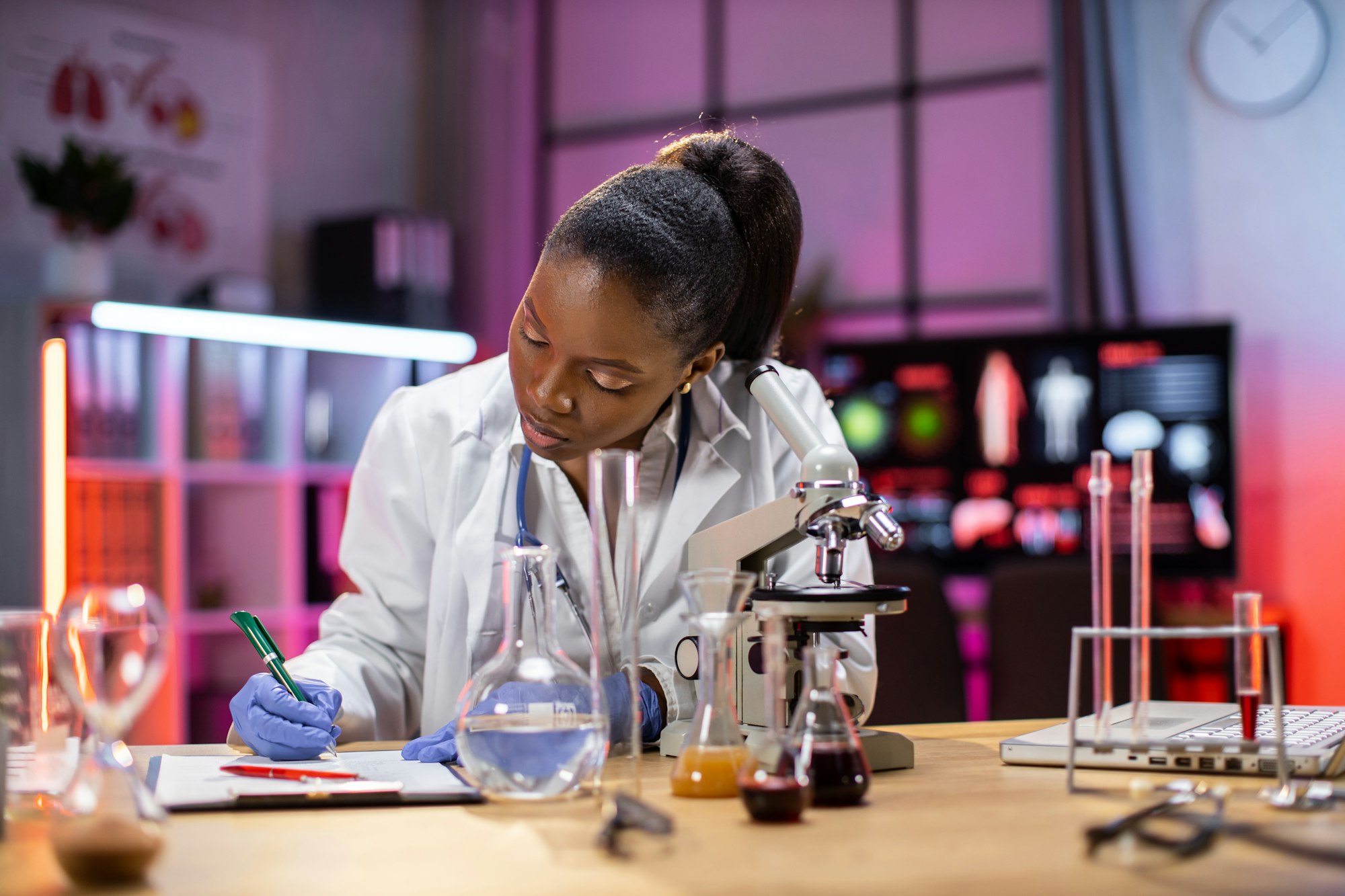 Female african american scientist working in laboratory.